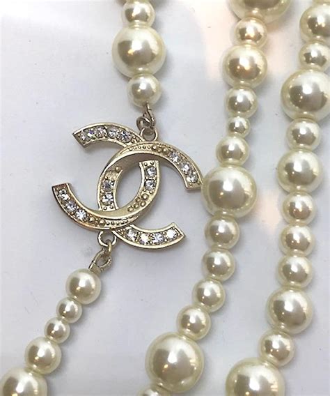 chanel necklace logo pendant|chanel pearl long strand necklaces.